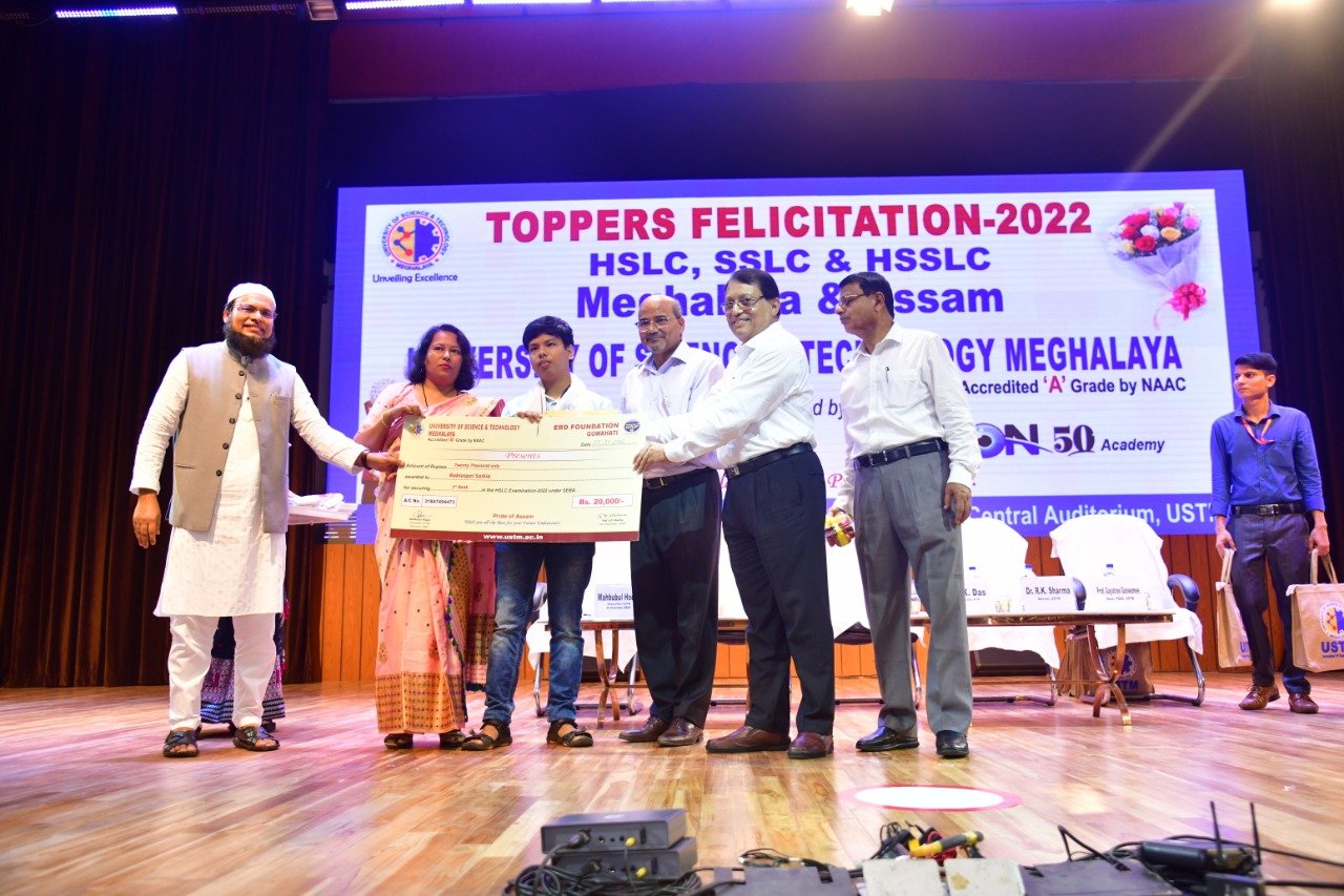 Assam HSLC 1st Rank holder RAKTOTPAL SAIKIA being felicitated with a cash award